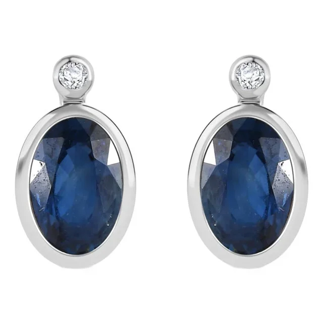 A Pair Classic Blue Sapphire Stud Earrings Set in 14 Karat Gold With Diamonds